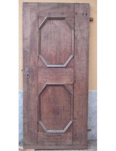 Porta in noce a un battente a due specchiature ottagonali