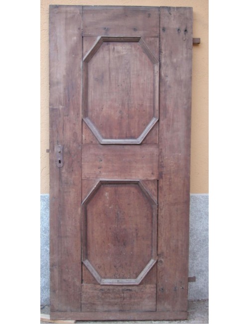 Porta in noce a un battente a due specchiature ottagonali