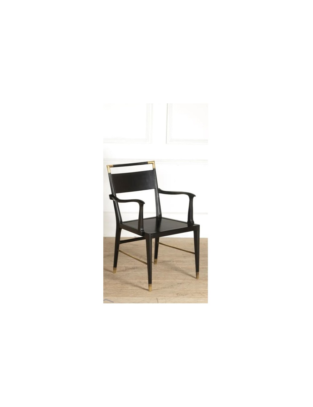 Black wooden armchair with modern brass inserts Black wooden armchair with modern brass inserts
