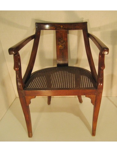 Poltrona con sedile in paglia e schienale intarsiato in ottone. Stile Impero