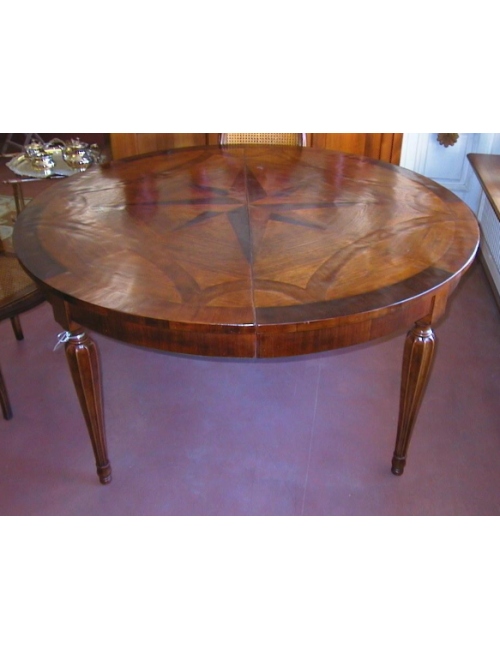 Extending walnut table with inlays on modern top