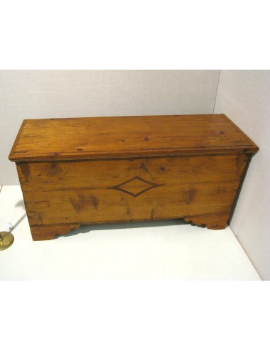 Spruce chest inlaid on façade