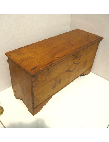 Spruce chest inlaid on façade