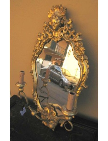 Mirror with wall sconce