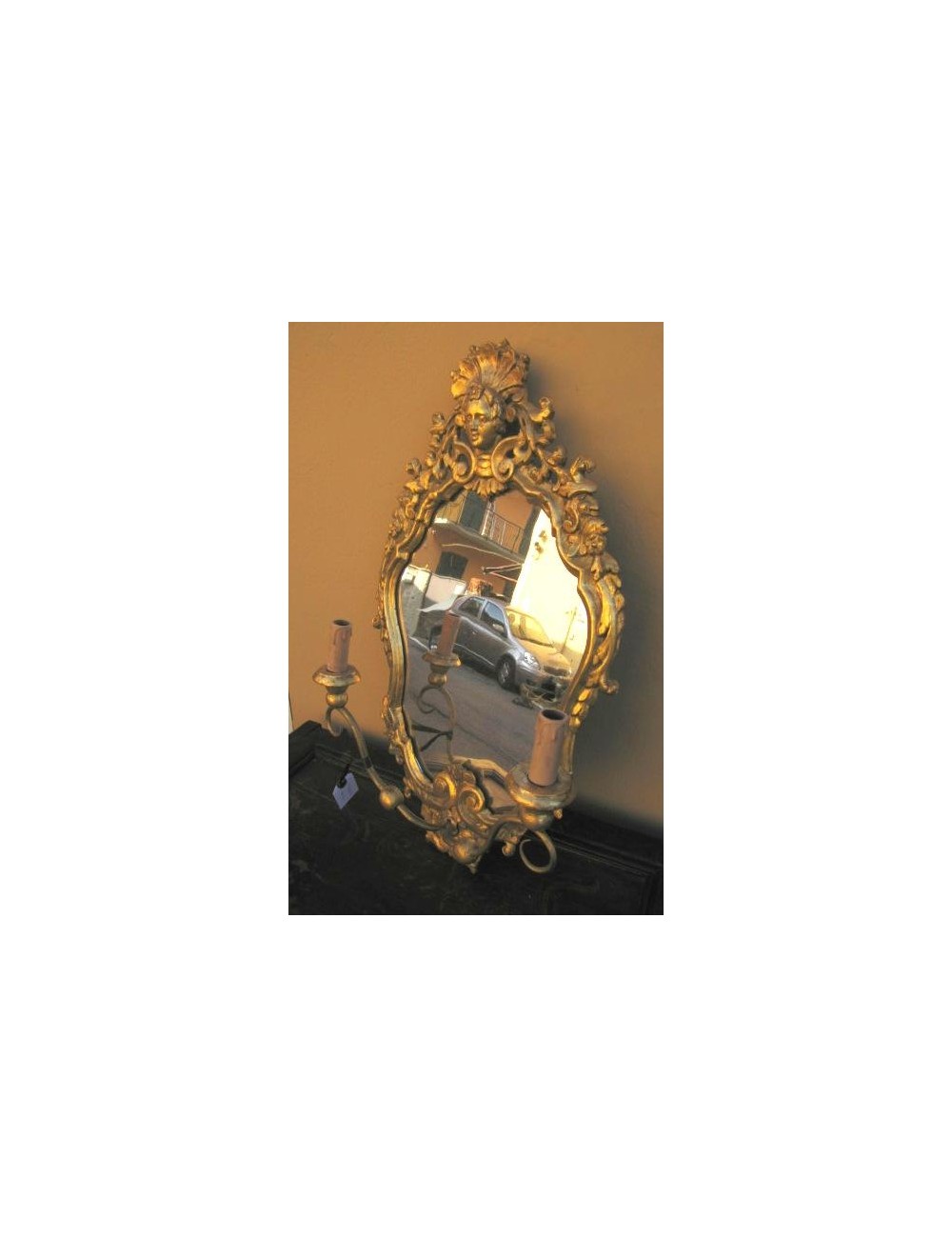 Mirror with wall sconce