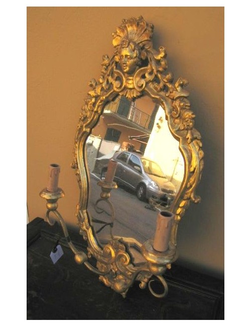 Mirror with wall sconce